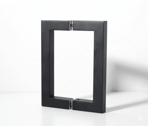 Black metal picture frame with open interior and metal clasps, casting a shadow on white background