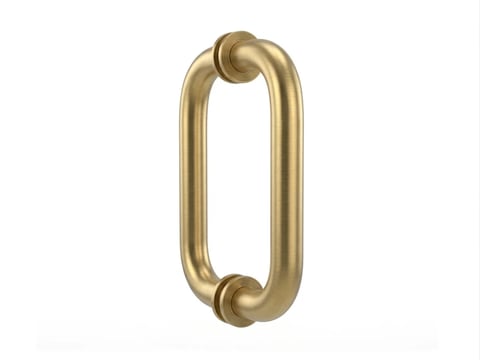 Brass or gold-toned oval door pull handle with rounded ends and decorative knob details