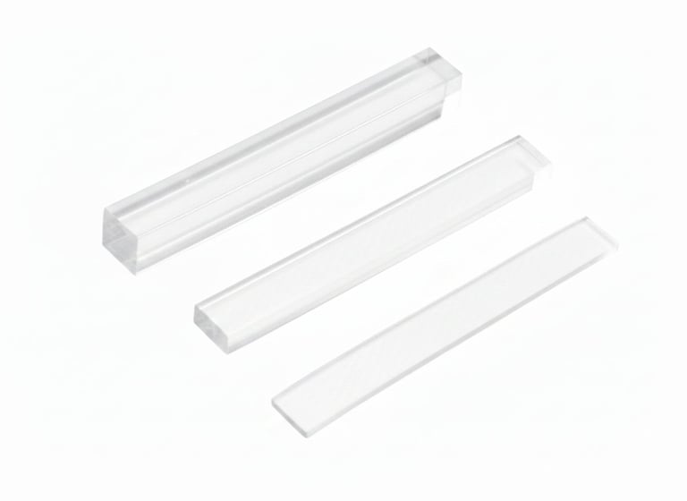Three white LED light fixtures of varying sizes arranged diagonally on a white background