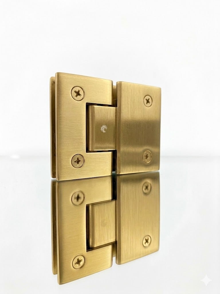 Brass glass door hinges with mounting plates and Phillips head screws, shown in open position