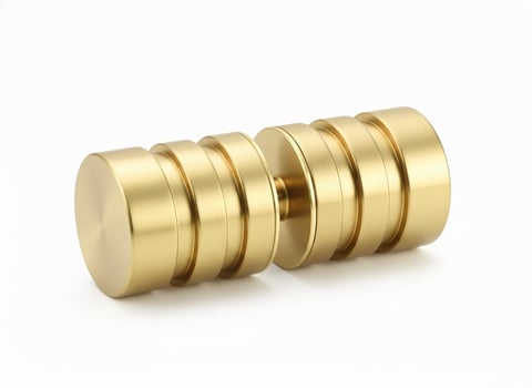 Golden brass coupling connector with multiple segmented ridges and grooves on a white background