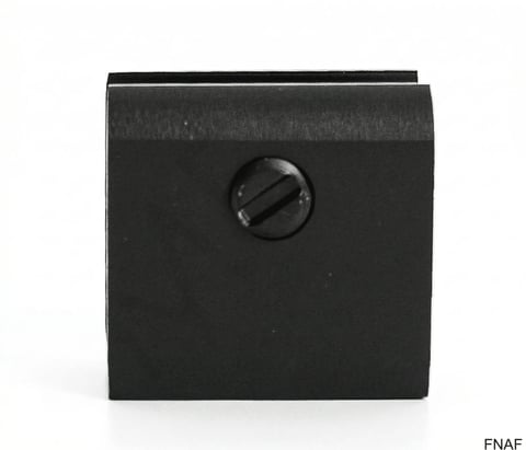 Black square electrical outlet or switch plate with a single circular knob or dial on front