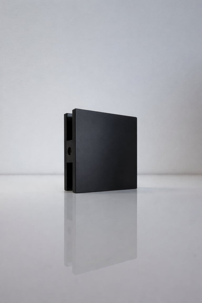 Black external hard drive displayed on white surface with gray background, showing reflection