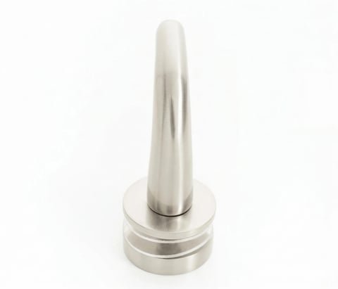 Silver cone-shaped object with ridged base on white background