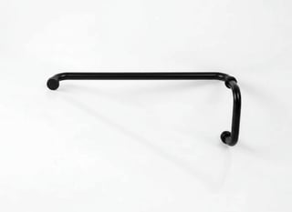 Black metal pull handle with decorative knobs mounted on white wall