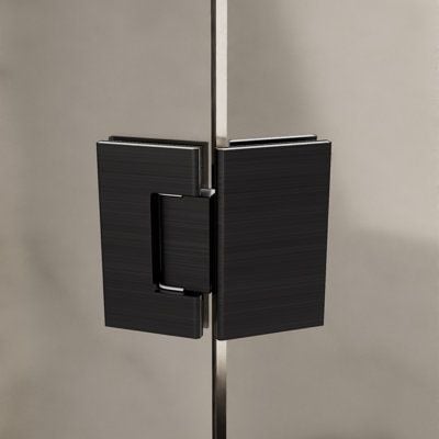 Black glass shower door hinge and handle mounted on a metal pole against a beige wall