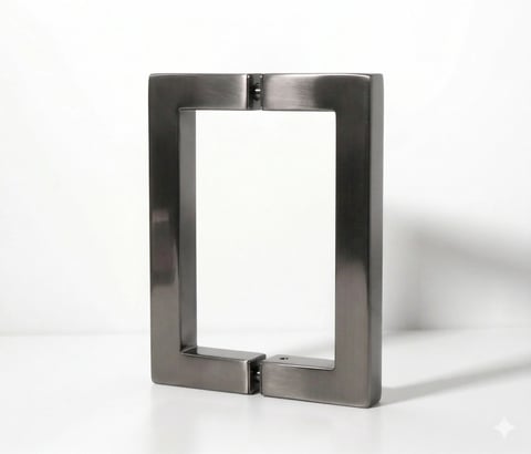 Metallic door pull handle with rectangular frame and chrome finish on white background