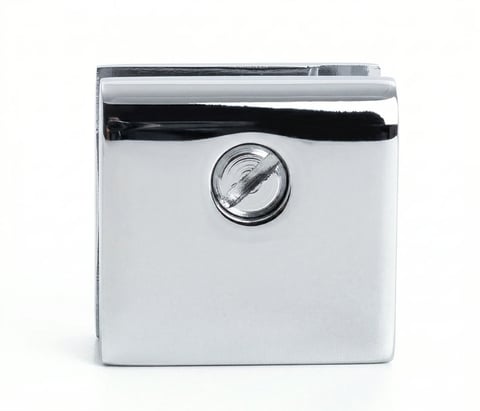 White and black cube-shaped device with circular dial and chrome accents on white background